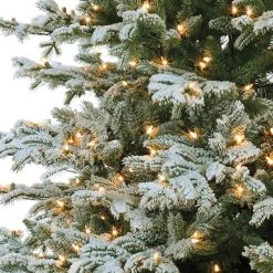 The Christmas Palace 9.5 FT VAIL SNOW PINE SLIM TREE PRE LIT WARM WHITE LED CHRISTMAS TREES